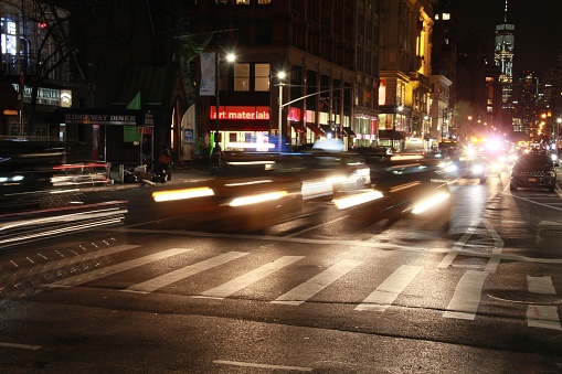 A busy street at night. 